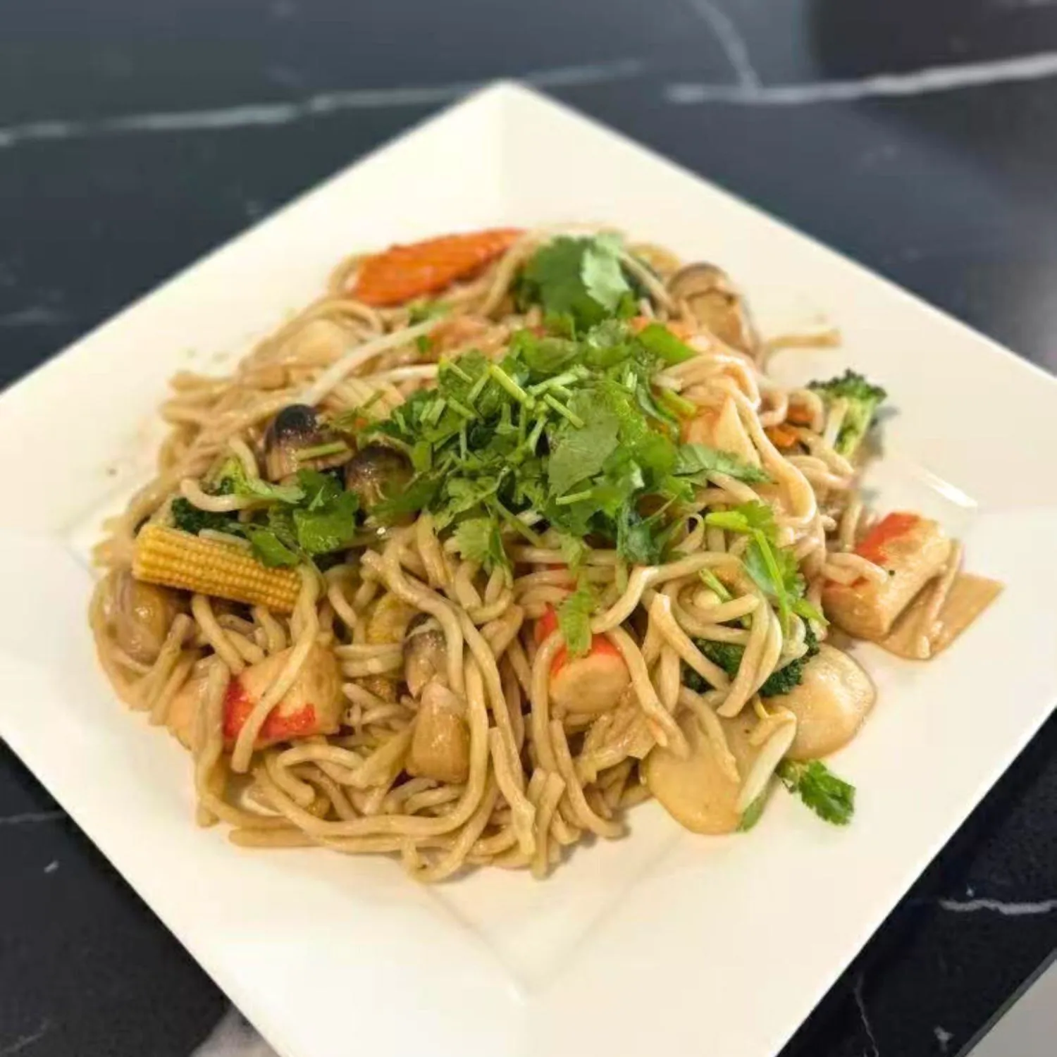 Stir-fried noodles with seafood, vegetables and cilantro at Pho Luu Escondido - Vietnamese Cuisine Restaurant in Escondido