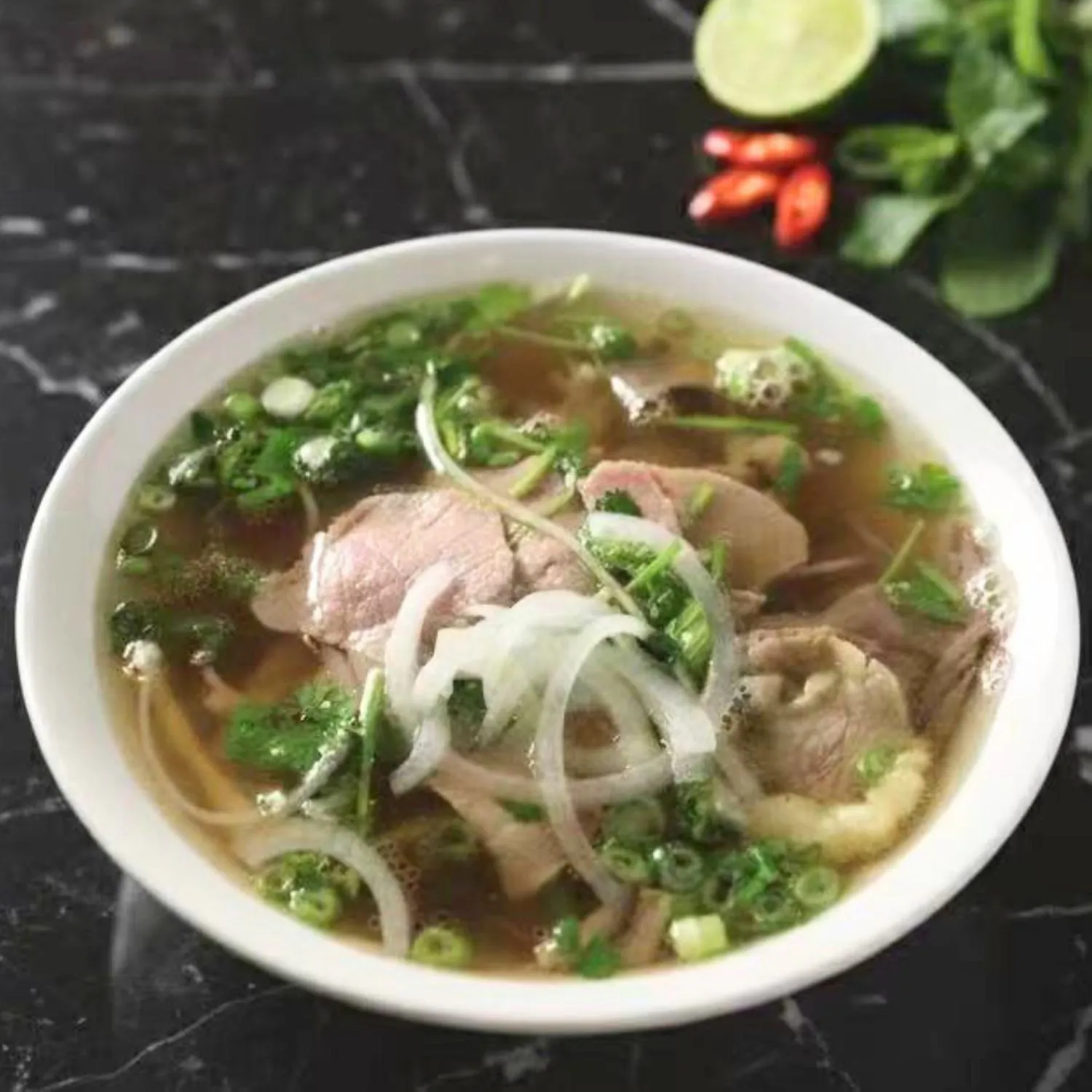 Beef pho with tender beef, herbs and rice noodles at Pho Luu Escondido - Vietnamese Cuisine Restaurant in Escondido