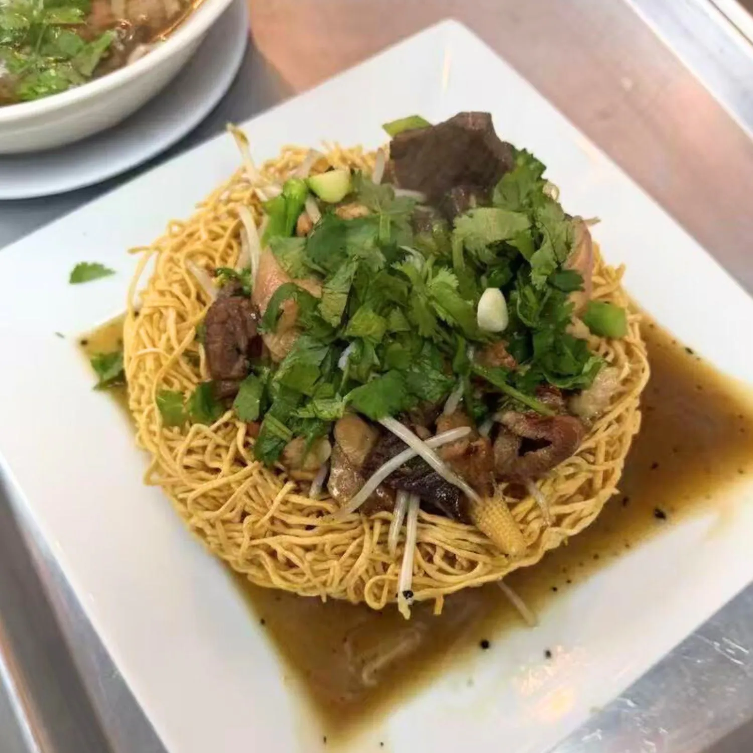 Crispy noodles with beef, chicken and fresh herbs at Pho Luu Escondido - Vietnamese Cuisine Restaurant in Escondido